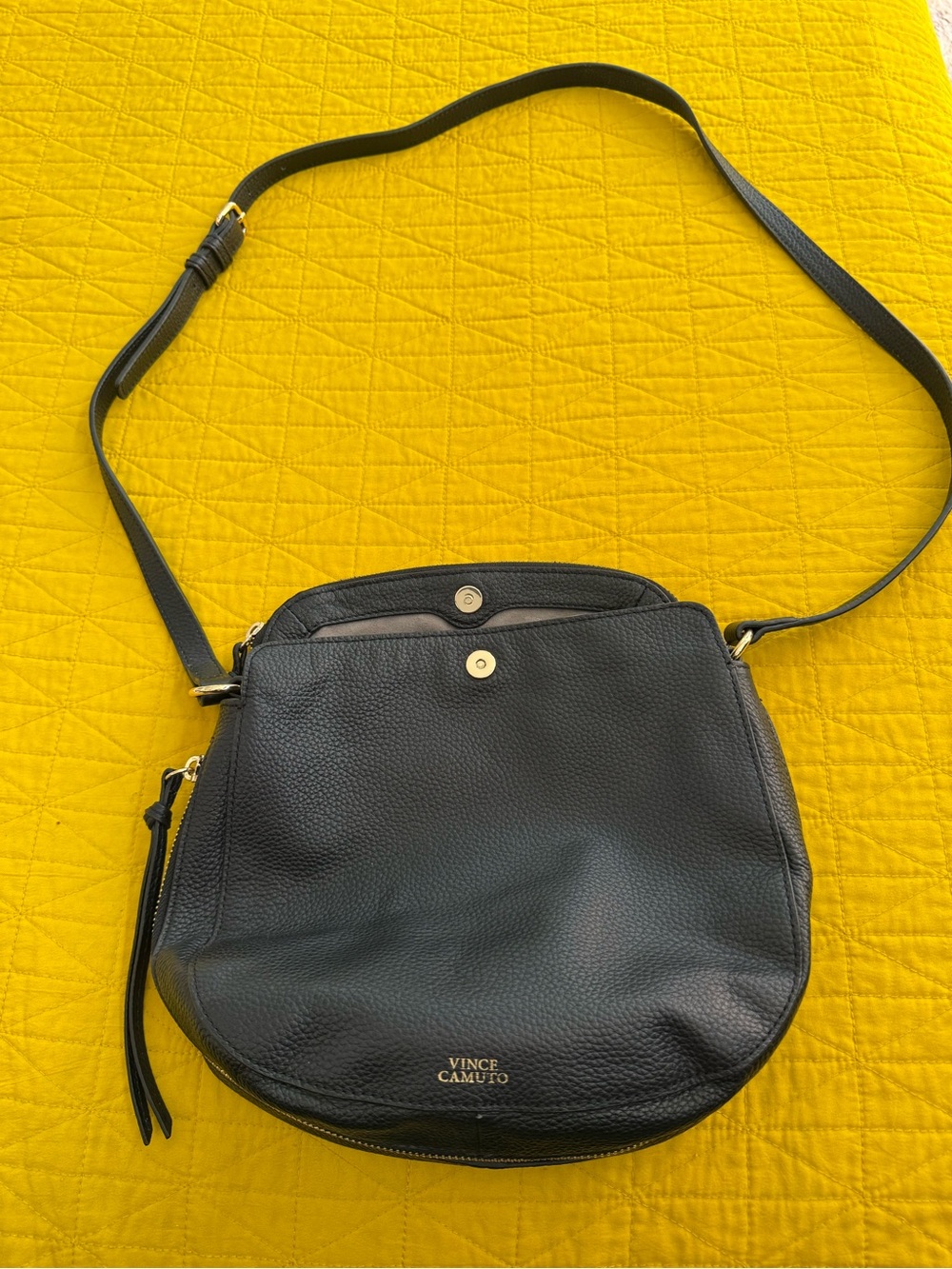 Vince Camuto black leather purse with gold accents.